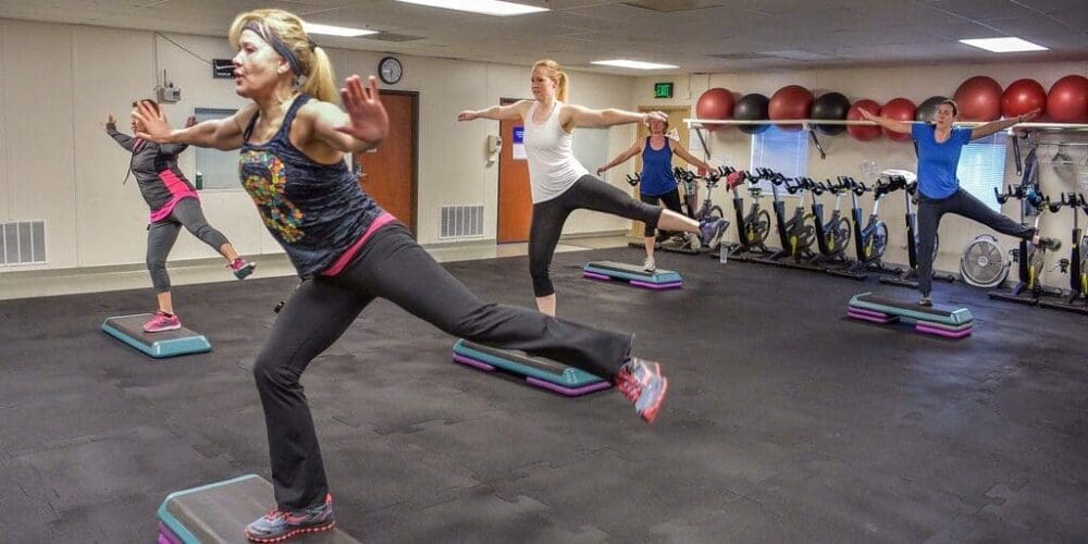 Group of Women - Step Aerobic Exercise Workout - Aerobic Workouts